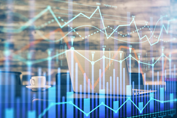 Forex market graph hologram and personal computer on background. Double exposure. Concept of investment.