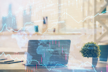 Stock market chart hologram drawn on personal computer background. Double exposure. Concept of investment.