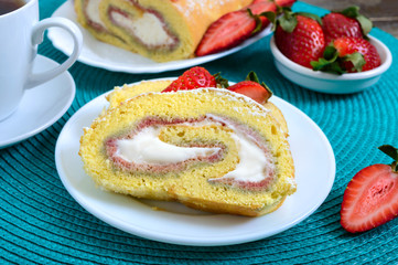 Obraz na płótnie Canvas Sweet biscuit roll with strawberries and cream on a wooden background