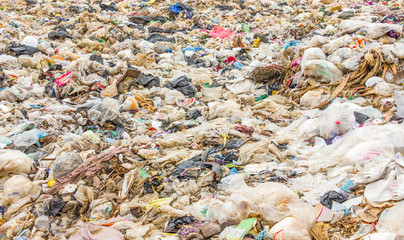 garbage dump pile in trash dump or landfill,truck is dumping the gabage from municipal,garbage dump pile , pollution concept