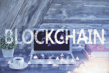 Double exposure of blockchain theme hologram and table with computer background. Concept of bitcoin...
