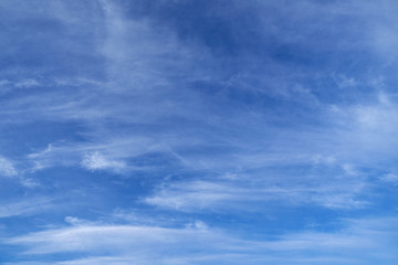 Bright beautiful blue sky with soft clouds for background or texture
