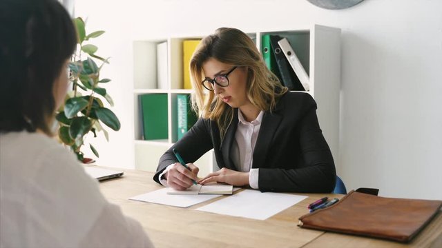 Young female candidate interviewed by employer