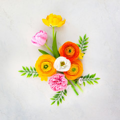 Holiday concept with spring flowers on pastel vintage background with copy space for text.