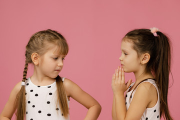 the two girlfriends quarreled. one girl is offended, and the second apologizes.