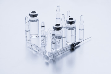 Ampoules for injection. Glass medical vials for vaccination. Transparent bottles and disposable...