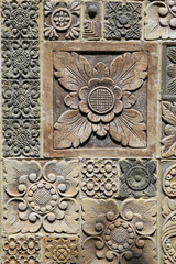 Hindu style carvings and ornaments,detail from stone wall in Bali,Indonesia