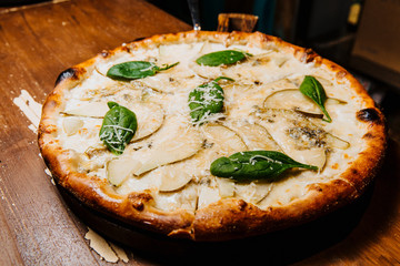 Delicious pizza with pear and blue cheese.