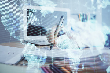 International business hud over woman's hands writing background. Concept of hard work. Double exposure