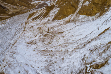 lanscape with barren mountain which is covered with ice