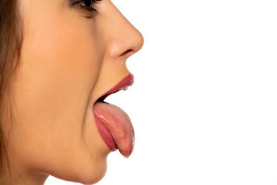 profile of young woman with tongue out