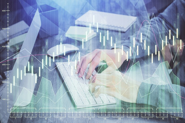 Stock graph with businessman typing on computer in office on background. Concept of analysis....