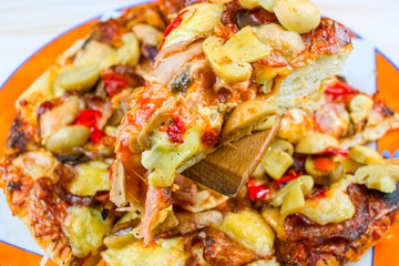 Pizza on the table with mushrooms