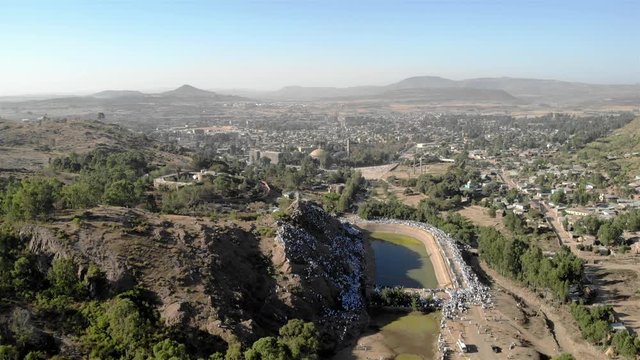 Drone view over Ethiopian Timkat Ceremony Gathering at reservoir for baptism , Axum, Ethiopia,19.1.2020
