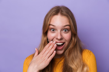 Fototapeta premium Photo of excited young woman expressing surprise and looking at camera