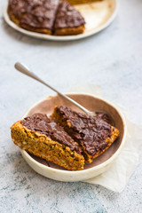 Carrot cake, chocolate pie on plate. Vegan  dessert and healthy diet food.