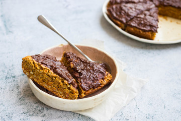 Carrot cake, chocolate pie on plate. Vegan  dessert and healthy diet food.