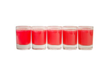 Red, same color transparent cocktails, a set of shots in one row, five servings. Side view Isolated white background. Drink for the menu restaurant, bar, cafe