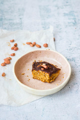 Last bite piece of chocolate carrot cake or pie piece on plate after sweet breakfast. Vegan and healthy diet food left. No sugar.