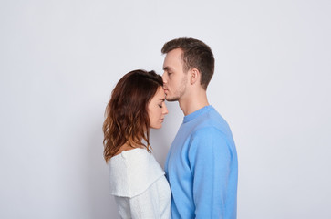 Delicate romantic couple in love in profile.