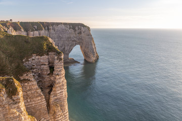 Rocks on the coast of the English channel strait. Etretat village, Normandy region, France.