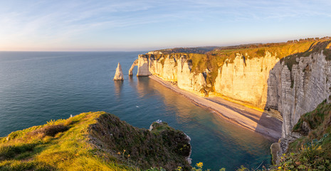 Rocks on the coast of the English channel strait. Etretat village, Normandy region, France.