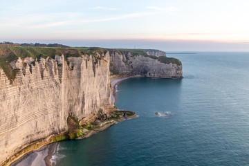 Rocks on the coast of the English channel strait. Etretat village, Normandy region, France.