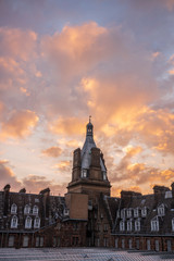 Fototapeta na wymiar The clouds glow during a sunset near in the Glasgow Central Station in Glasgow, Scotland, which is particularly noted for its 19th-century Victorian architecture.