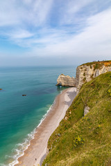 Rocks on the coast of the English channel strait. Etretat village, Normandy region, France.