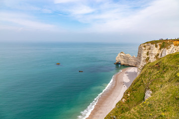 Rocks on the coast of the English channel strait. Etretat village, Normandy region, France.