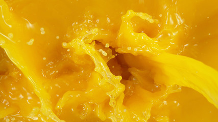 Detail of pouring orange juice