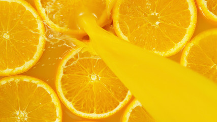 Fototapeta na wymiar Detail of pouring orange juice with slices