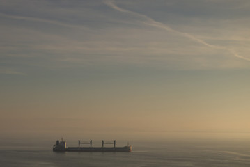 Ship on Tagus River in lisbon, Portugal at sunrise