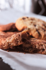 Cookie with chocolate and cocoa powder on paper 