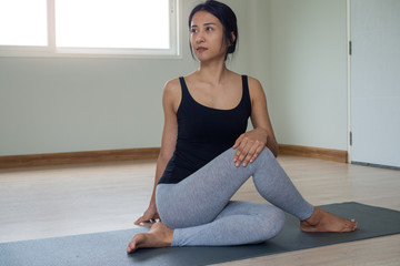 Women are doing seated twist exercises for health and a firmer body. yoga concept
