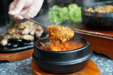Kimchi Soup with tofu and pork belly served in clay pot, One of the most loved of all the stews in Korean cuisine, Most popular food in Korea.