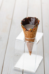 Sugar cone with coffee inside in a holder