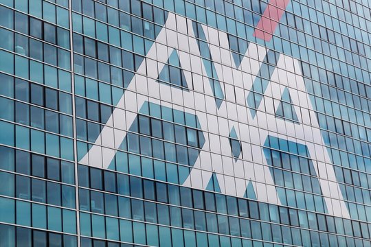 Milan, Italy - April 15, 2016: AXA office building in Milan. AXA is a French multinational insurance firm headquartered in Paris that engages in global insurance, investment management and financial s