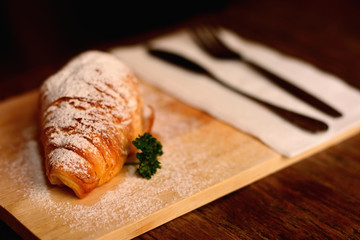 Croissant ham cheese sprinkled with flour, add with mint.
