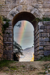 Arch at Ancient Roman Town in Southern Italy with Rainbow