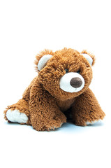 Cute brown bear. The toy is soft. Plush. Muzzle. Ears of paws and head. On white background