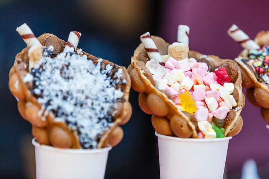 vanilla ice cream bubble waffle with fruit and sweets