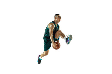 Obraz na płótnie Canvas Young basketball player of team wearing sportwear training, practicing in action, motion in jump, flight isolated on white background. Concept of sport, movement, energy and dynamic, healthy lifestyle