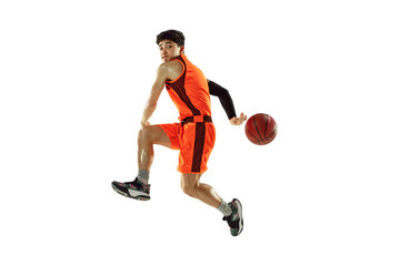 Young basketball player of team wearing sportwear training, practicing in action, motion in jump,...