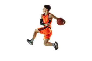 Fototapeta na wymiar Young basketball player of team wearing sportwear training, practicing in action, motion in jump, flight isolated on white background. Concept of sport, movement, energy and dynamic, healthy lifestyle