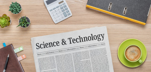 A newspaper on a desk with the headline Science and Technology