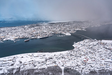 aerial of the city of Tromso at dawn of the end of the polar night, northern 