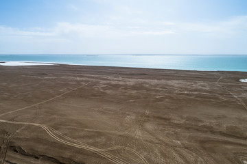 Fototapeta na wymiar aerial view of the shoreside of a salt lake