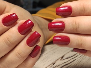 beautiful gel lacquer manicure on a textured background