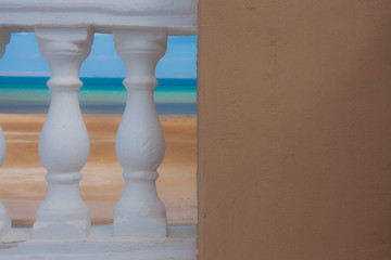 White railing against the sea.